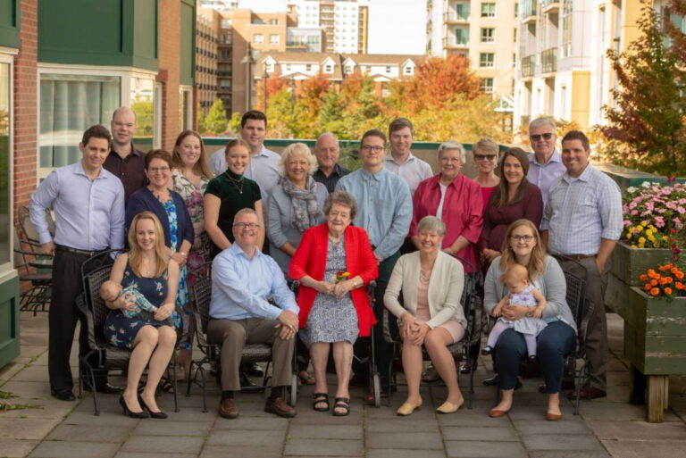 Photo of 6 families with their children and Grandmother on her birthday. Photo taken on location in Halifax, NS by Joe Chater of Moments in Time Photography Studio