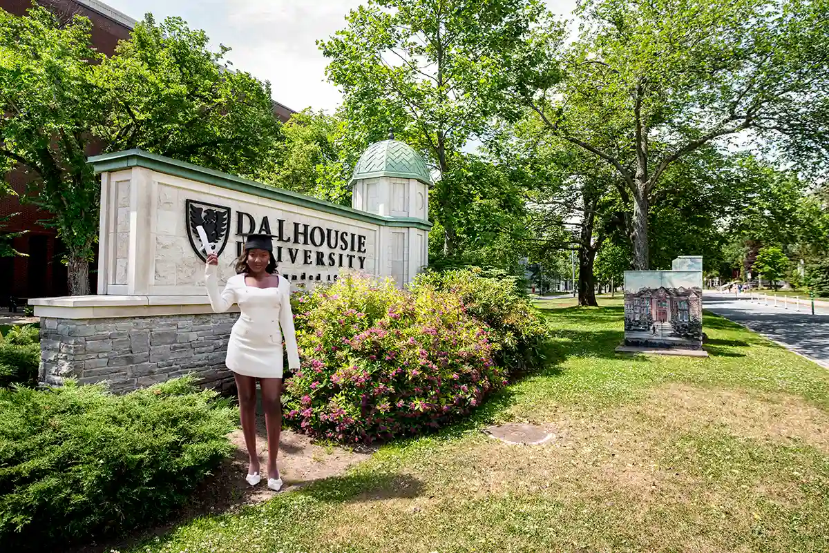 Professional Dalhousie University graduation portraits in Halifax featuring authentic nursing gown and hood