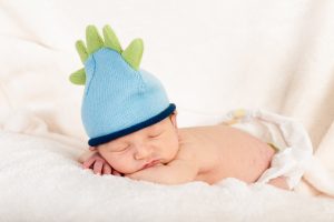 Newborn baby with hat taken at our studio.