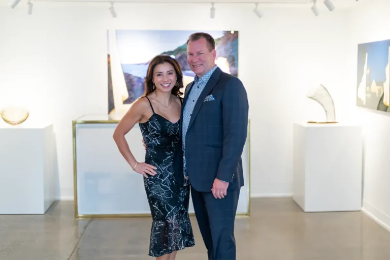 Elegantly dressed couple posing for a photo booth portrait at an art gallery event in Halifax by Moments in Time Photography Studio