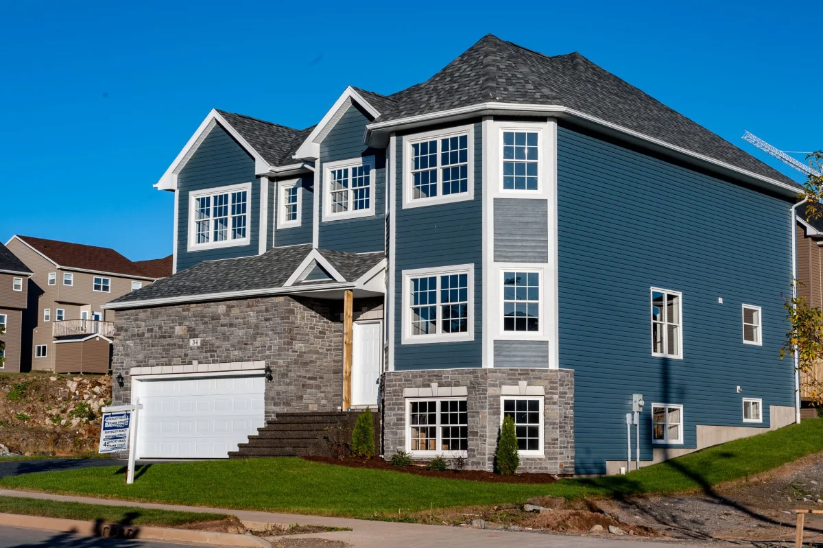 Real Estate Photography 7 Home exterior photographed at twilight with warmly lit windows, Halifax real estate photography